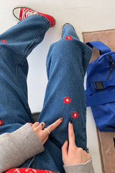 Rote lange Jeanshose mit Gänseblümchen-Stickerei