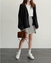 Suéter tipo cárdigan de punto liso y suelto