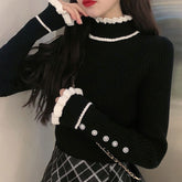 Suéter de punto con botones y encaje de cuello alto