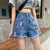 Sexy Jeansshorts mit Blumenstickerei und Quaste