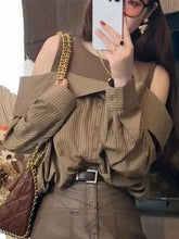 Blusas elegantes a rayas con hombros descubiertos