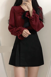 Blusa de manga larga con lazo y volantes