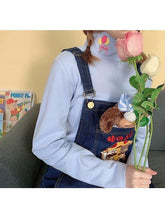 Camisa de manga larga con cuello alto y bordado de dibujos animados