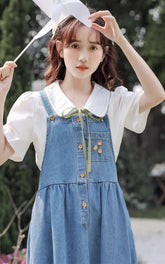 Schürze mit Mohnmuster und Knopfleiste