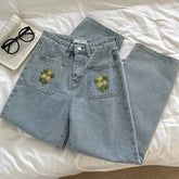 Vaqueros de bolsillo con bordado de margaritas y estrellas