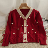 Strickjacke mit kleinen Bommeln