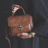 Signature Swivel Satchel Bag