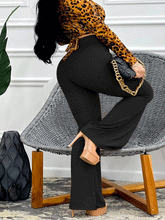 Pantalones acampanados de cintura alta y color liso