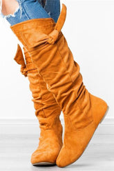 Botas planas con cremallera y lazo