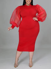 Vestido midi con mangas farol y abertura en la costura