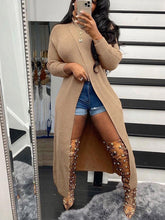 Suéter de punto con cuello alto y dobladillo con abertura