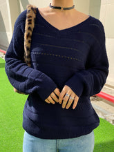 Suéter de punto abierto con cuello en V