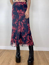 Falda midi floral con paneles de malla