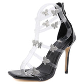 Sandalias de tacón alto con tiras y punta cuadrada con detalle de mariposa - Negras