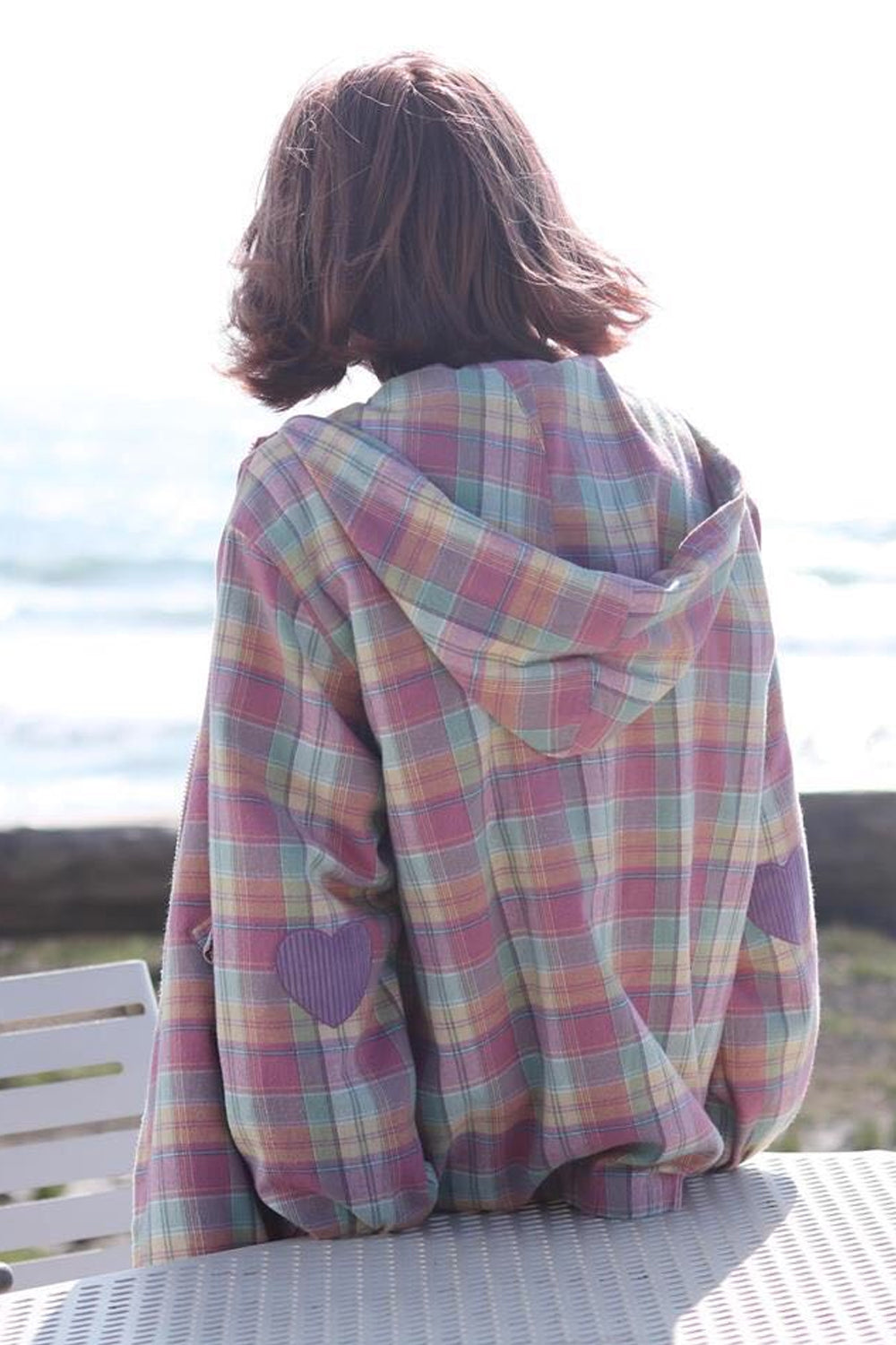 Chaqueta con capucha y cremallera a cuadros rosa pastel