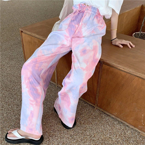 Pantalones deportivos de pierna ancha con efecto tie-dye en color rosa 