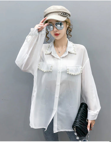 Blusa de gasa con cuentas y mangas largas 