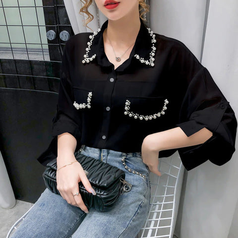 Blusa de gasa con cuentas y mangas largas 