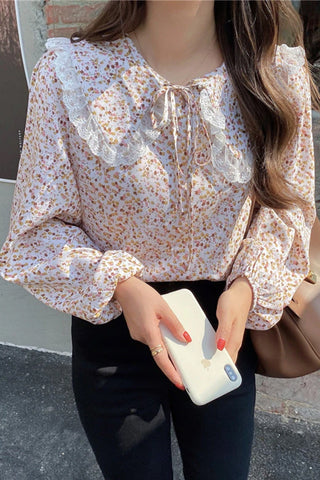 Blusa de manga larga con cuello Peter Pan y estampado floral