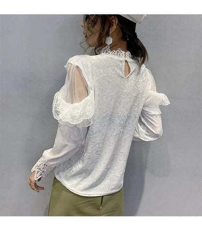 Blusa elegante de malla de encaje con cuello alto 