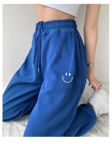 Pantalones deportivos con bordado de carita sonriente 