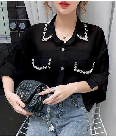 Blusa de gasa con cuentas y mangas largas 