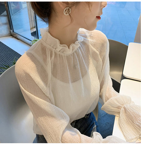 Camisa de gasa transparente con mangas acampanadas y holgadas