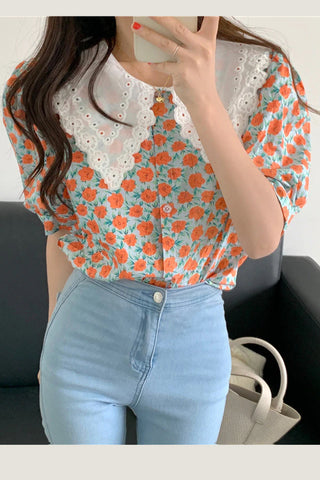 Camisa elegante tipo blusa de oficina con estampado floral retro