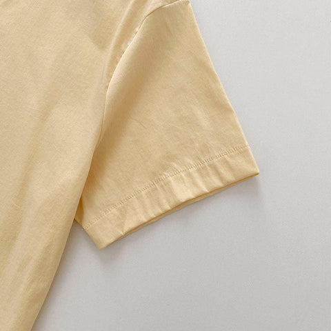 Camisa con botones de caramelo