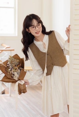 Chaleco corto de tweed con bolsillos