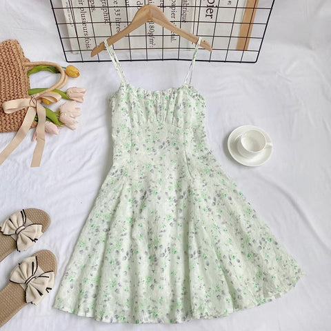 Vestido mini de tirantes con rosa descolorido