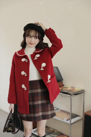 Abrigo tipo trenca con cuello Peter Pan y botones