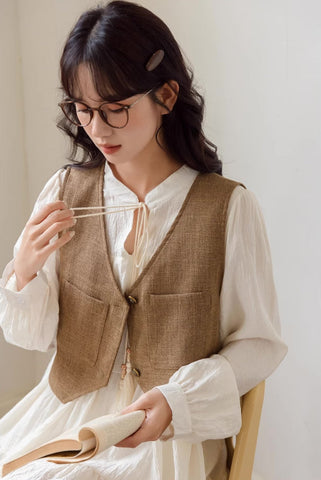 Chaleco corto de tweed con bolsillos