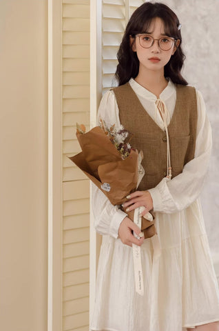 Chaleco corto de tweed con bolsillos