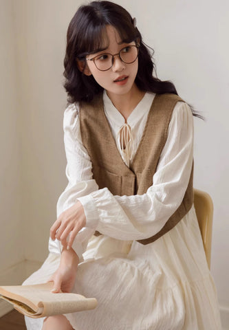 Chaleco corto de tweed con bolsillos