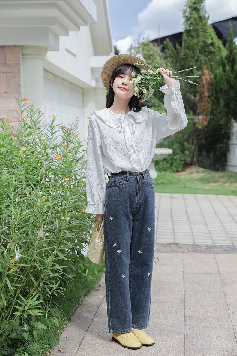 Jeans mit Gänseblümchen-Stickerei