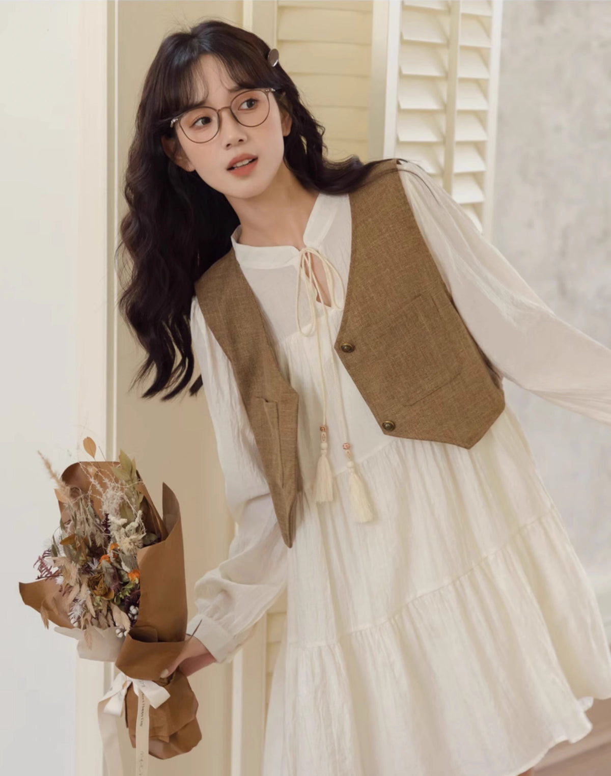 Chaleco corto de tweed con bolsillos