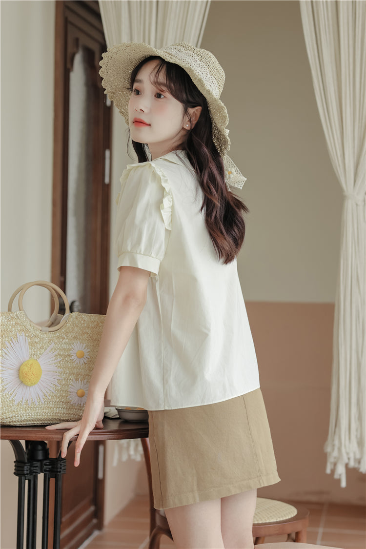 Blusa de manga corta con cadena de margaritas