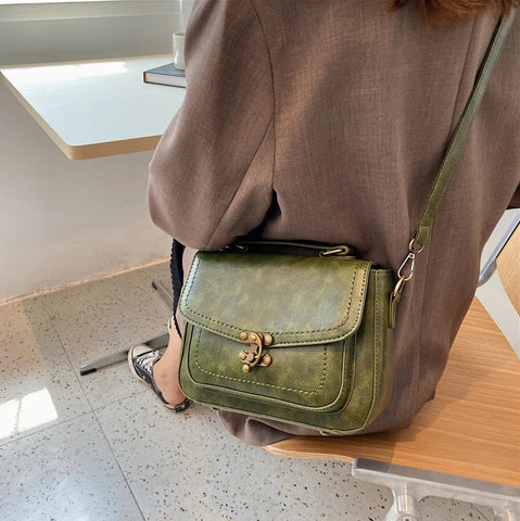 Signature Swivel Satchel Bag