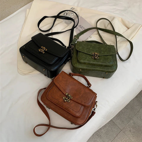 Signature Swivel Satchel Bag