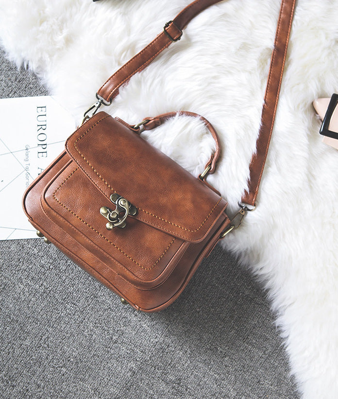 Signature Swivel Satchel Bag