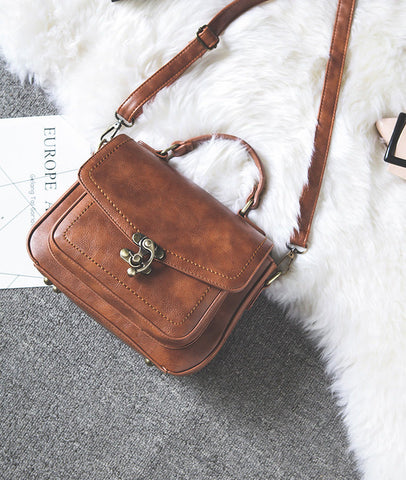 Signature Swivel Satchel Bag