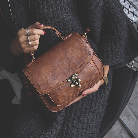 Signature Swivel Satchel Bag
