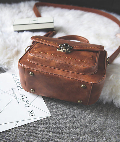 Signature Swivel Satchel Bag