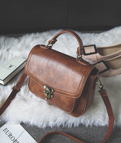 Signature Swivel Satchel Bag