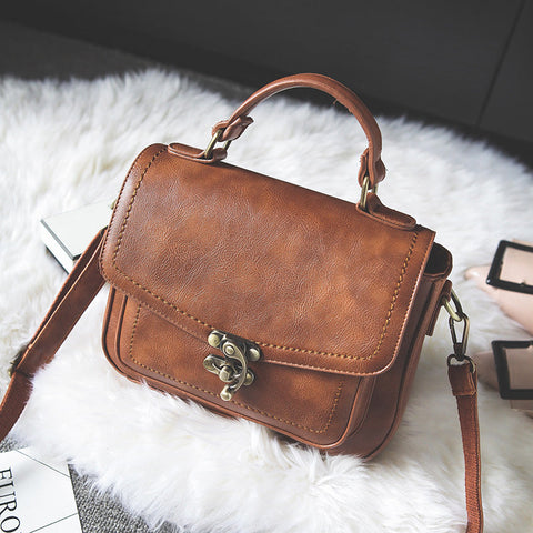 Signature Swivel Satchel Bag