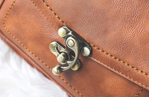 Signature Swivel Satchel Bag