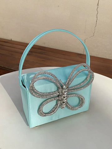 Clutch de mariposa con diamantes de imitación