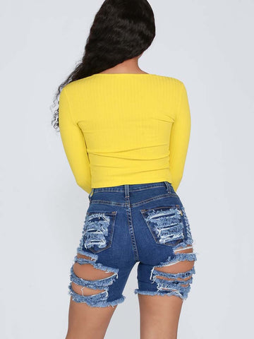 pantalones cortos de mezclilla rotos