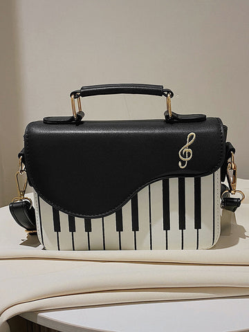 Bolsa bordada con música y estampado de piano